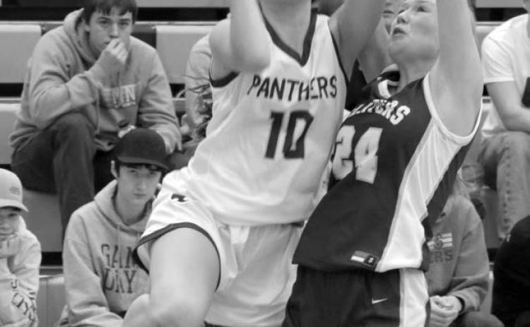 Freshman guard Jaylee Schoelerman draws a foul from Strasburg-Zeeland defender Jordyn Heidrich during action at the Mobridge Rotary Classic on Saturday, Dec. 16. Timber Lake downed the Clippers to improve to 2-3 on the season. Photo by Jon Flatland