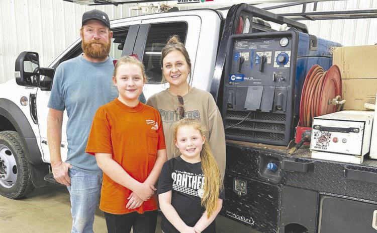 OP and Kella Schlosser with their daughters, Rae’ah and Emma.