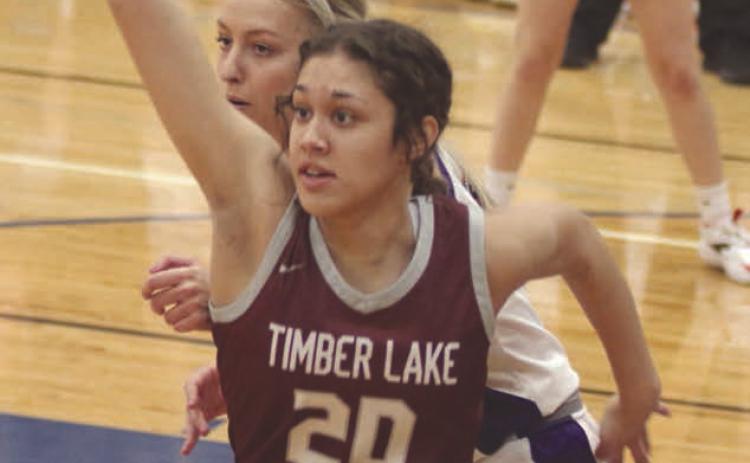 Sophomore center Jasmine Nash looks for the ball while battling for position under the basket with a Castlewood defender during their SoDak 16 matchup last Thursday in Redfield. The rebound leader for the Lady Panthers this season, Nash finished the contest with 12 points and four boards Photos by Jon Flatland