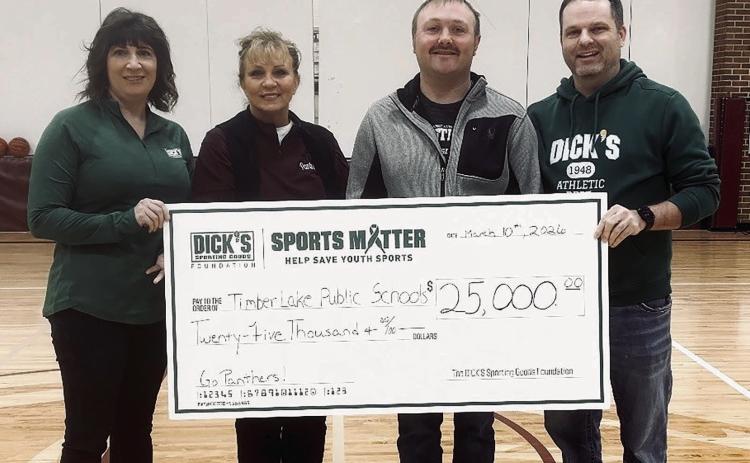 The Timber Lake School District was recently awarded a $25,000 donation from the DICK’s Sporting Goods Foundation to be used for purchasing wrestling mats and upgrading volleyball equipment. Pictured (l-r) are TLHS alum Randi Aberle, Supt. Lori Enright, wrestling coach Sawyer Sandquist, and Michael Shaughnessy, manager of DICK’s Sporting Goods in Bismarck, ND.