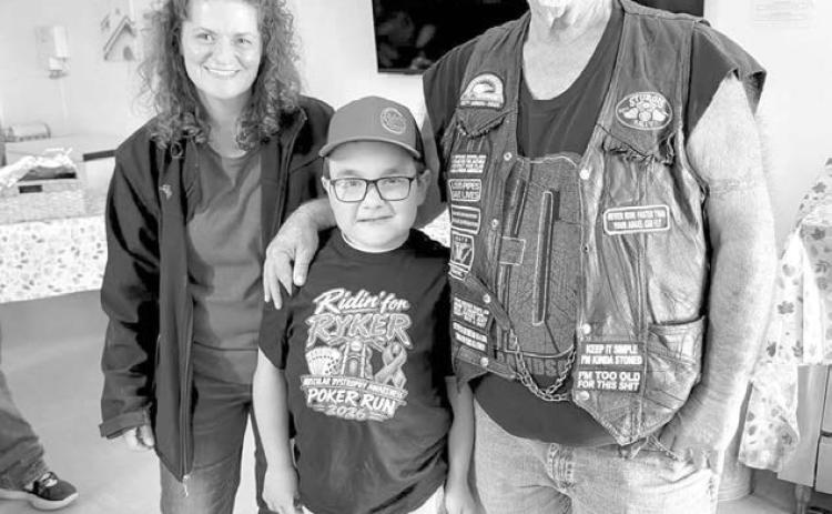 The Ridin’ for Ryker Poker Run was held September 26 to raise funds to help his family with Ryker’s ongoing medical expenses. Pictured with Ryker are (left) Robi Miller, high hand winner, and Dode Ley, low hand winner. Photo by Marie DuPreez