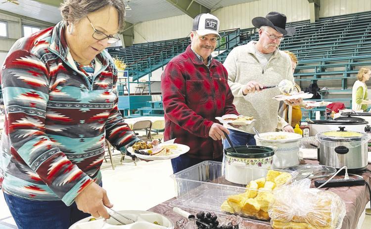 The Isabel Community Center was filled with the smell of great food and the sound of great fellowship on Sunday, Nov. 3, during the Prairie Parsish Churches annual Fall Festival. Among those enjoying turkey, ham and more were (l-r) Laurie and Bill Bickel and Jeff Stradinger. Silent and live auctions were held following the meal. Photo by Kathy Nelson