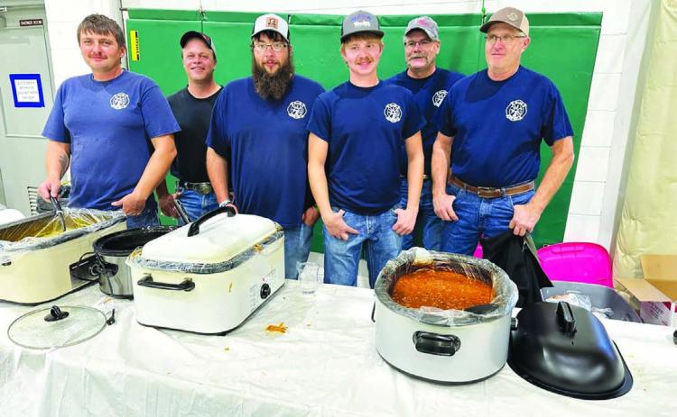 Serving up homemade chili and chicken noodle soup are Isabel Volunteer Firefighters L-R: Brent Spafford, Tony Russell, Patrick Bridges, Riley Lindskov, Lynn Stradinger, and Bill Lindskov.