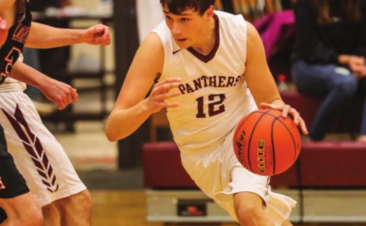 Timber Lake starter Dixon Booth dribbles to the hoop during a home contest versus Faith. Photos by Robert Slocum
