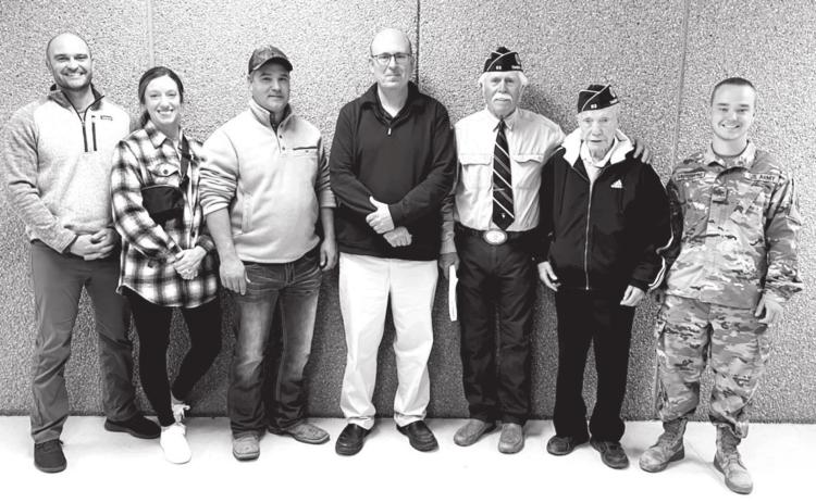 Veterans and active military personnel recognized at the Timber Lake Middle/High School Veterans Day program on November 10 were (L-R): Major Jason Booth (active US Air Force); Kay Booth (active US Air Force); Adrian Winterberg (US Army); Dan Martin (Army National Guard); Jack Bickel (US Army); Andy Aberle (US Army); and Jesse Winterberg (active SD National Guard).