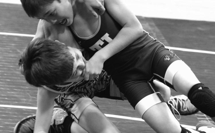 Ryder Veit (right) of the Timber Lake Youth Wrestling Club, holds Dupree’s Kemper Longbrake in a headlock while driving him to the mat during their Midgets 67 Division match at the first-ever Panther Invite Triangular featuring wrestlers from Timber Lake, Dupree and Mobridge. Veit finished third at the SDWCA District 3 regional championship last weekend and will compete at the state meet March 1517. Longbrake placed fourth in regionals, just missing the cut for state qualification. Photo by Jon Flatland
