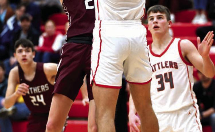 Timber Lake senior Kyler Bollinger puts a shot over the outstretched arms of a Potter County defender during the Panthers’ matchup with Potter County last Friday, Feb. 23. Bollinger finished the contest with five points. Timber Lake tipped off the Region 8B Boys Basketball Tournament on Tuesday facing Takini in the first round. Photo by Marie Du Preez