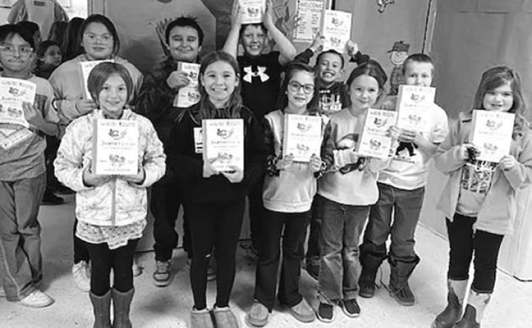 Third graders across the state, including these from Timber Lake Elementary School, received a free book from the S.D. Humanities Council and a group of sponsors. Photo courtesy of Carrie Beer