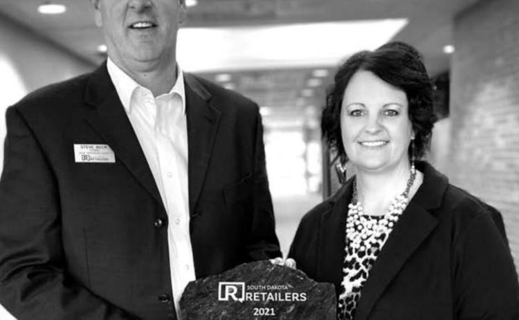 Dana Keffeler (RIGHT), owner of Keffeler Kreations in Faith, received the Retailer of the Year award at the SDRA annual banquet in Pierre.