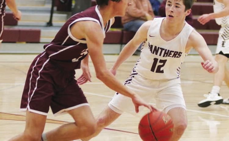 Panther sophomore Cole Ducheneaux (12) plays defense against McIntosh earlier this season. Photo by Jon Flatland
