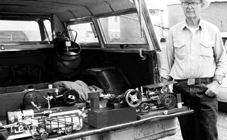 Ray Moland with some of his miniature farm machines