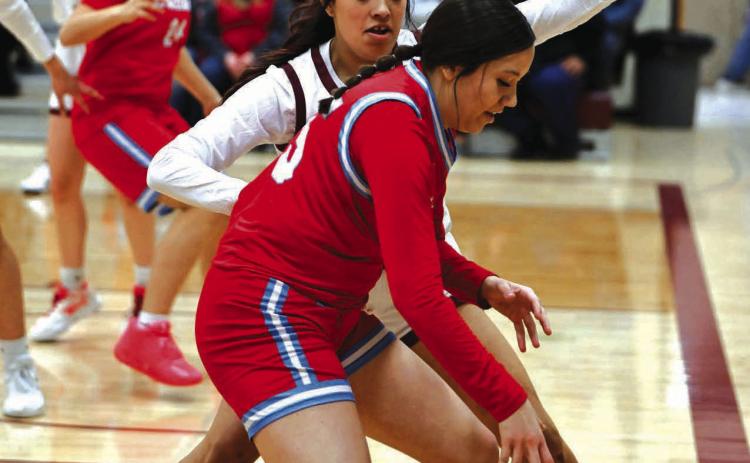 Timber Lake junior Kessa Bigger plays defense against Cheyenne-Eagle Butte junior KaiLoni Johnson during a non-conference inter-county matchup between the two teams last Friday. The Region 8B Girls Basketball Tournament tipped off play-in games on Monday. Timber Lake was facing Wakpala in first round action at Harding County on Tuesday, Feb. 20, as this issue of the Topic went to press. More sports on Pages 8-10. Photo by Marie Du Preez