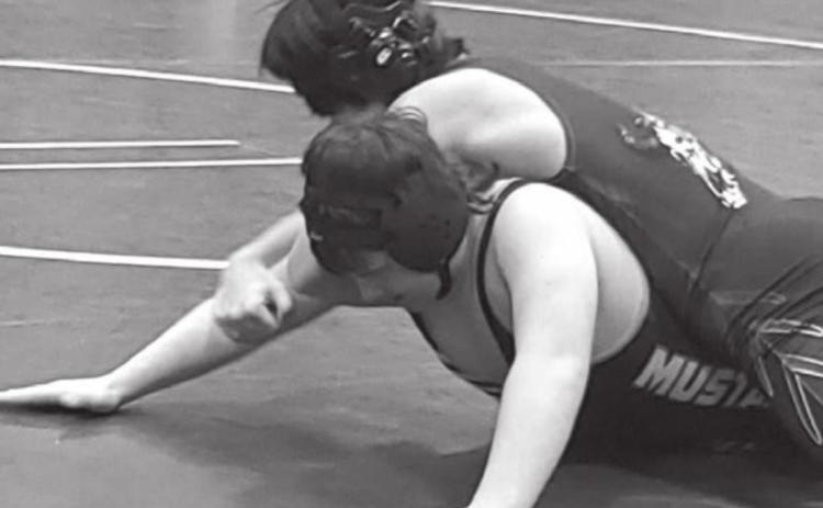Brady Maher (bottom) wrestles for the Mclaughlin/Timber Lake Mustangs.