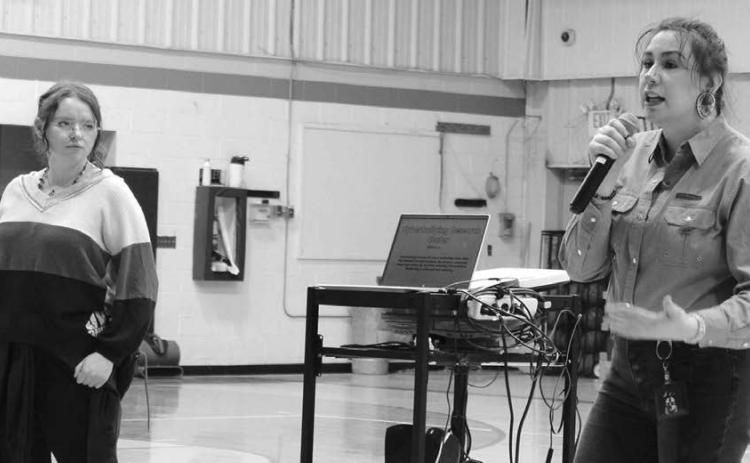 Alex Peterson (L) and Tayzia Claymore Knight (R), from the Sacred Heart Center, presenting to the Dupree students about the dangers of online stalking.