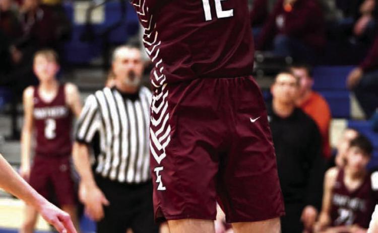 Junior Cole Ducheneaux puts up a running jumper against Lemmon in the Region 8B Tournament. Photo by Marie Du Preez