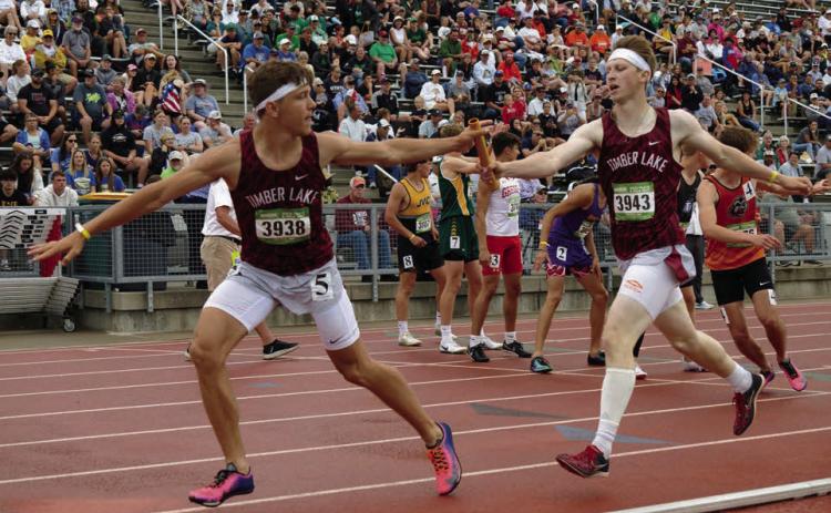Holden Gill(right) passes the baton to Broc Bauer during the boys 1600 meter relay at the South Dakota State Track &amp; Field Meet last weekend. Gill and Bauer along with Landen Bieber and Jackson Bigger finished third overall. Check out the Topic Facebook page for more photos from the state finals. Photo by Marie DuPreez