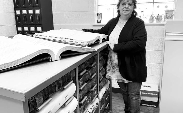 The Dewey County Commission is considering a new space for safekeeping of property records and files in the Register of Deeds office. Cost estimates from HKG Architects range from $109,000 to $265,000 plus architectural fees. Register of Deeds Deborah Goldade (ABOVE) has accumulated about $42,000 for the project from fees paid by users. Photo by Kathy Nelson