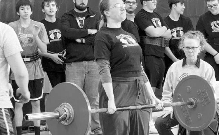 Maria Scherer completes one of her lifts at a powerlifting meet in Box Elder last week. Scherer took first place in her division.