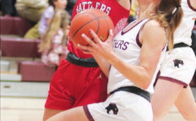 Timber Lake’s Shay Kraft drives for a lay-up against a Potter County defender during action earlier this month. Kraft leads an undefeated Lady Panther squad into the conference tournament beginning Thursday, Jan. 19. Photo by Jon Flatland