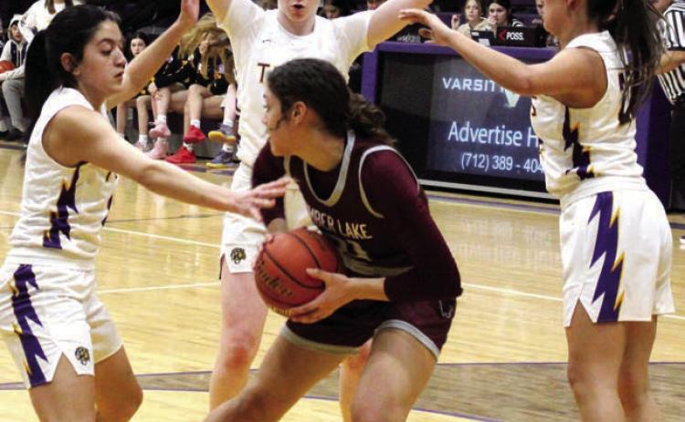 Timber Lake’s Jasmine Nash found herself surrounded by Dupree Tiger defenders after pulling down a rebound during action last Tuesday in Dupree. Nash notched a double-double with 14 points and 10 rebounds but Dupree collected a 56-52 win. Photo by Patty Peacock