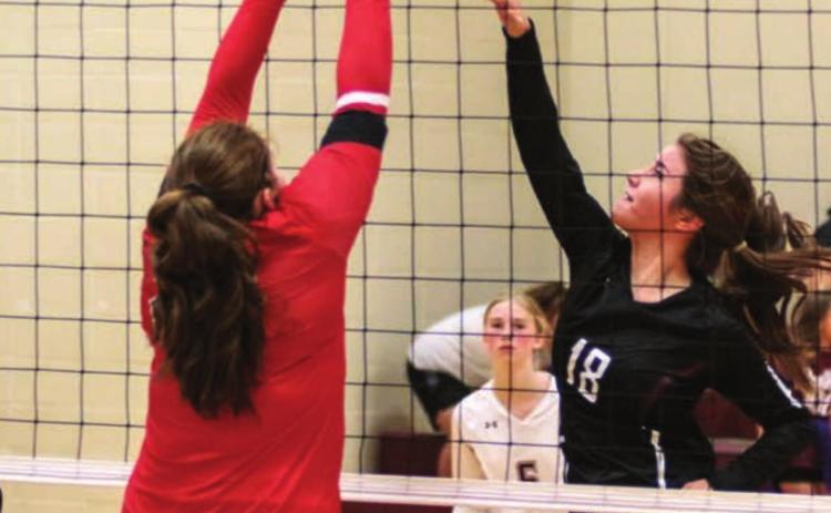 Timber Lake’s Natalie Gross (18), Sara Holzer (24) and Averie Marshall (5) in action versus the Bison Cardinals last week. Photo by Jon Flatland