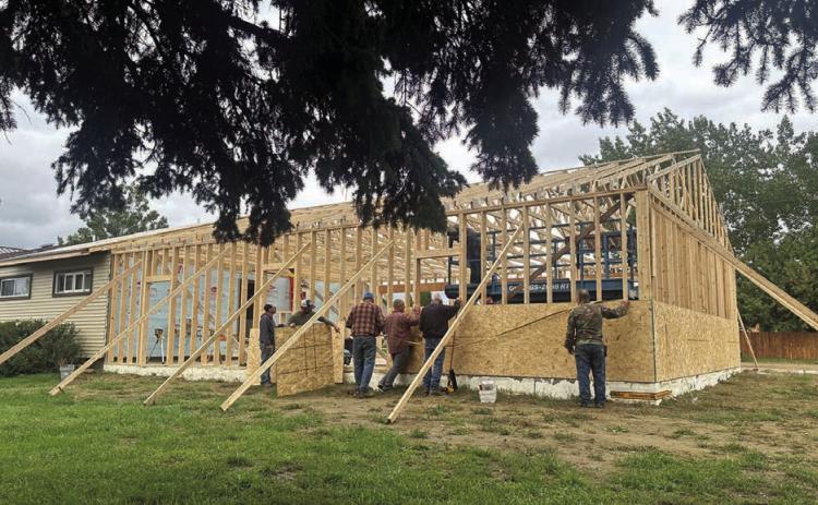 Volunteers have been busy - when it isn’t raining - building an attached garage at the Holy Cross Church rectory.