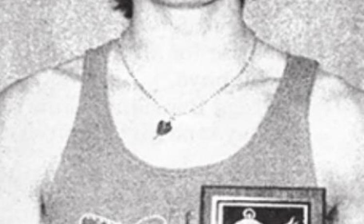 Doug Kraft with the plaque he was awarded when he was named the MVP of the Hoven Legion Relays track meet on April 14.