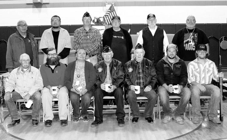 Veterans at the Dupree Veterans Day program included Front (LR): Jim Schmidt, Peter Stahlbrand, Lynnea Swan, John D. Lemke, Clint Farlee, Tate Fischer, Garrett Fischer; Back (L-R): Mike Shaving, Conan Morrison, Leo Bakeberg, Craig Ness, Shannon Hinrichs, and Mark Peacock.
