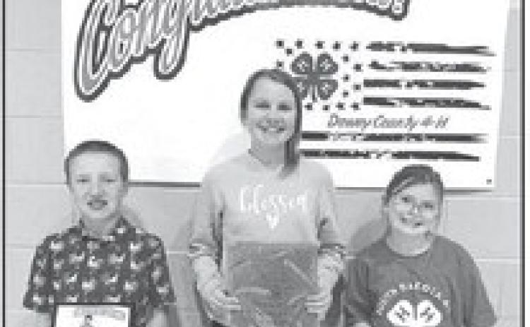 Greyson Goldade (left) received the Family and Consumer Science Award; Maya Biegler (middle) received the Club Secretary Award; and Stella Nilson (right) received the Club Reporter Award.