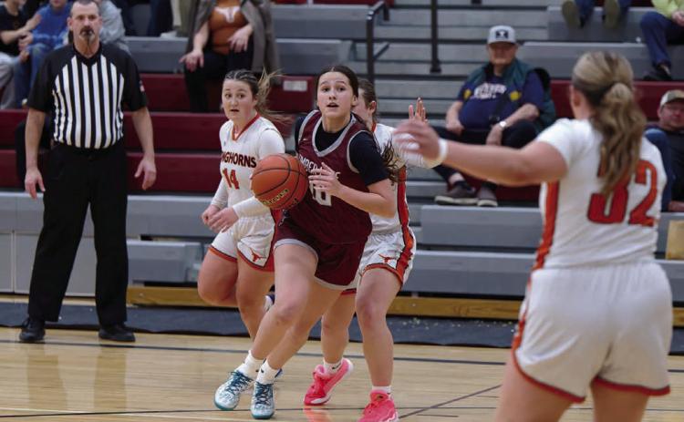 Timber Lake forward Jaylee Schoelerman dribbles past a pair of Faith defenders and looks for a lane to the basket or a teammate she can dish to during the Panthers’ overtime victory over the Longhorns last Tuesday, Jan. 6. Schoelerman played a key role in the win, finishing the game with a team-high 16 points. Timber Lake will host Sully Buttes on Tuesday, Jan. 20 before the LMC Tournament in Lemmon Jan. 23-24. Find more sports on Pages 8-10. Topic photo by Marie DuPreez