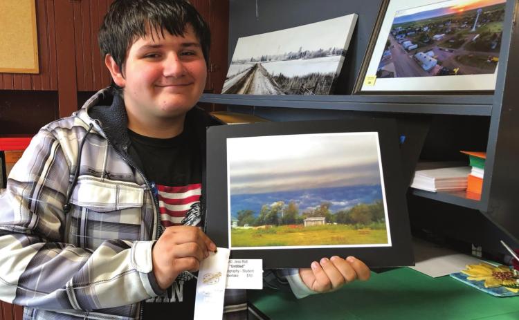 Jesse Ridl of Timber Lake with his photograph that won a ribbon at the Mobridge Art Show.