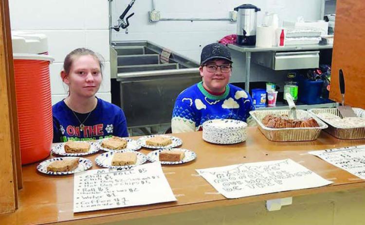Tristan Swift and Gabe Bridges were selling concessions at the craft fair to raise funds for a Washington, DC trip being organized through the Timber Lake School.