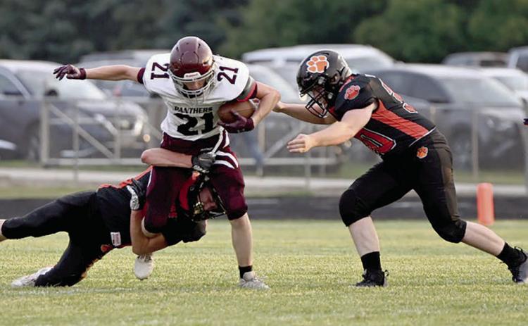Panther wide receciver Eddie Keller (21) battles for yardage on a pitch-out during first half action of Timber Lake’s football season opener at Ipswich last Friday, Aug. 23. Timber Lake hosts Philip at Doug Kraft Field on Friday, Aug. 30, with kickoff set for 6 p.m. Photo by Jon Flatland