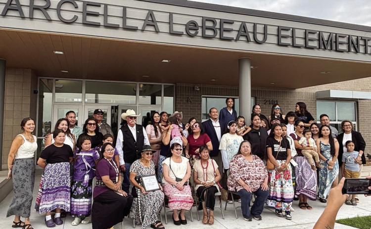 Members of Marcella LeBeau’s family gather for a photo under the front entrance to Marcellaa LeBeau Elementary School in Sioux Falls after a dedication and naming ceremony for the new school last week. LeBeau wss a respected elder and matriarch of the Cheyenne River Sioux Tribe. Submitted photo