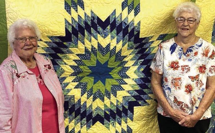 Twila Schuler, left, was the lucky winner of this year’s beautiful Dupree Volunteer Fire Dept. Auxiliary quilt. Each year, for the past 33 years, Virginia Till (right) has made and then generously donated a lovely quilt for the Dupree Volunteer Fire Department Auxiliary to raise funds with by doing a raffle during the Dupree Pioneer Days Celebration. Photo by Patty Peacock
