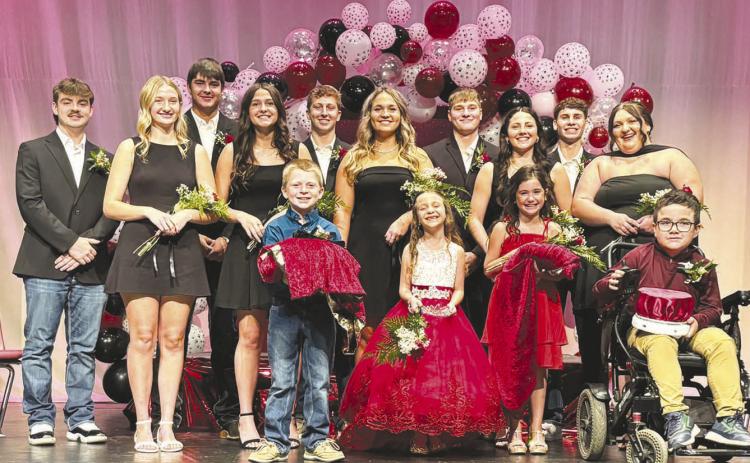 Pictured before the crowning of the TLHS Homecoming king and queen are the candidates and attendants. Front (l-r): Robe bearer Trevor Aberle, crown bearer Elliott Schweitzer, robe bearer Blake Booth, and crown bearer Ryker Bridges; Back: King and queen candidates Treyden Beer, Paislee Keller, Kanton Hunt, Jaylee Schoelerman, Hudson Gill, Katelyn Biegler, Kolby Holzer, Ruby Maher, Braden Lawrence, and Anna Kraft. Photo by Julie Marshall