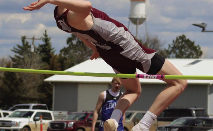 Senior Kyler Bollinger clears the bar at 5-8, a personal best, to win the high jump crown at this year’s Little Moreau Conference Track Meet held last Thursday, May 9, at Kraft Field in Timber Lake.