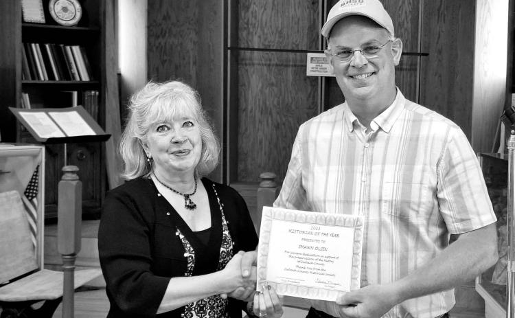 LEFT: Kim Shannon (left) presents Shawn Olsen with the Historian of the Year award.