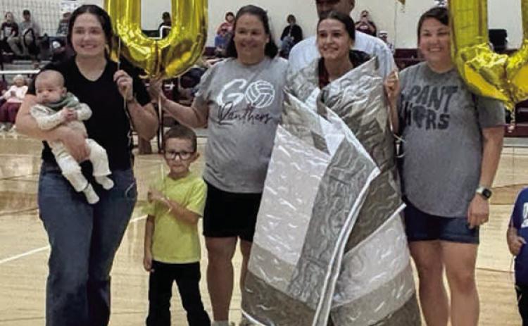 Senior Jaylee Schoelerman was recogniszed at the volleyball game on September 15 after scoring her 1000th career assist. She was presented a star quilt and other gifts She is shown with members of her family. TL School Photo