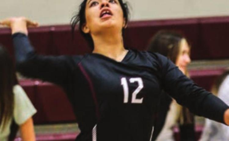 Kessa Bigger gets ready to send a serve over the net.