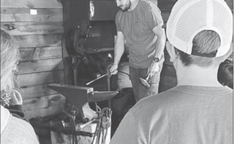 Kyle Nilson gave a demonstration for 4-Hers at the Timber Lake Museum’s Blacksmith Shop.