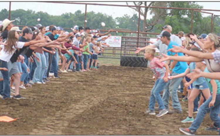 ABOVE: The egg toss at the Days of 1910 Demolition Derby drew a large number of participants this year. It ended in a three-way tie.