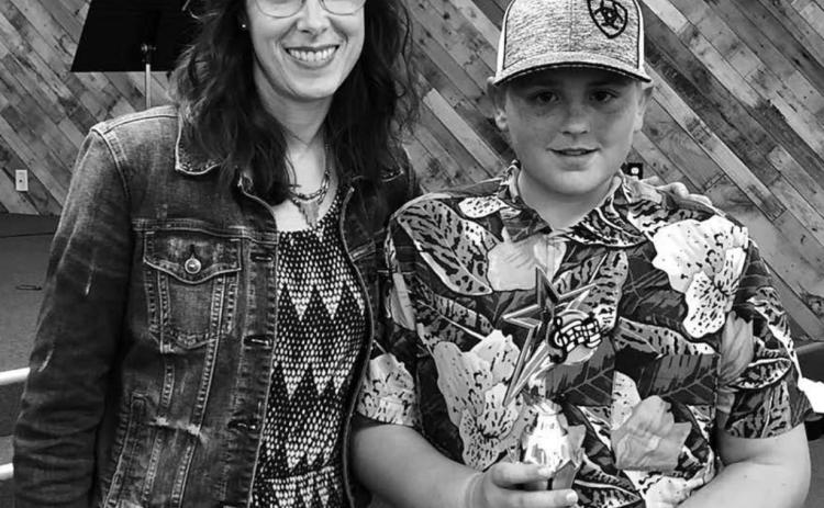 LEFT: Colette Schaffer presented Mason Bickel with the Studio Award. Mason composed and performed an original song, with lyrics.