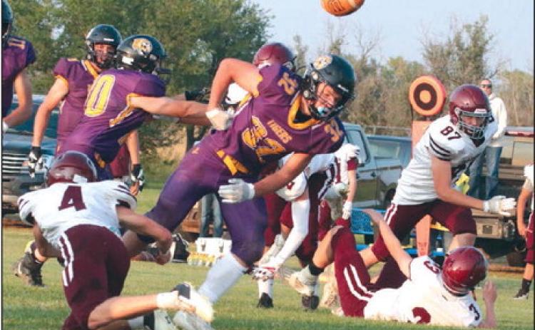 Dupree running back Braydon Terveen-Smith coughs up the football after taking a hard shot from Timber Lake defender Gracen Hansen (4) during the second quarter of the Tigers’ 26-6 upset over the Panthers last Friday, Sept. 9. Terveen-Smith was Dupree’s plow horse, finishing the contest with 110 yards and three TDs on 27 rushing attempts. Photos by Jon Flatland