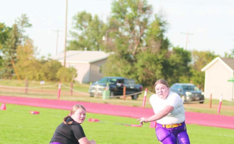Twin sisters Cassidy and Carsyn Farlee - former youth soccer players - handle extra-points and field goals for the Dupree Tiger football team. Photo by Jon Flatland