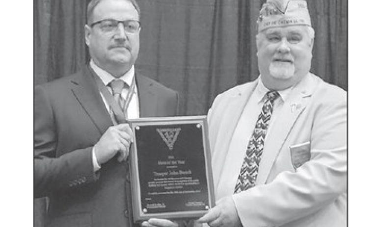 Chef de Chemin de Fer Frank Campo, right, National President of the Society of the Forty Men and Eight Horses, presents the Hero of the Year award to Trooper John Berndt last month. Berndt is a 1997 graduate of McIntosh High School.