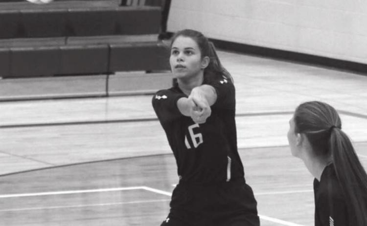 ABOVE: Timber Lake’s Manuela Molinera-Munoz bumps a serve back over the net.