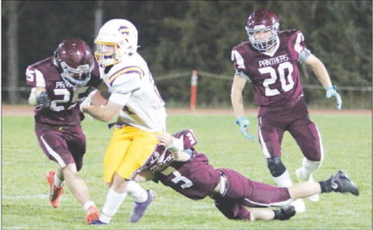 Timber Lake’s Caleb Bieber (25) and Holden Gill (3) combine to take down a Stanley County runner while Thane Keller (20) moves in to assist during the Panthers overtime win over the Buffaloes last Friday, Sept. 30. Photo by Jon Flatland