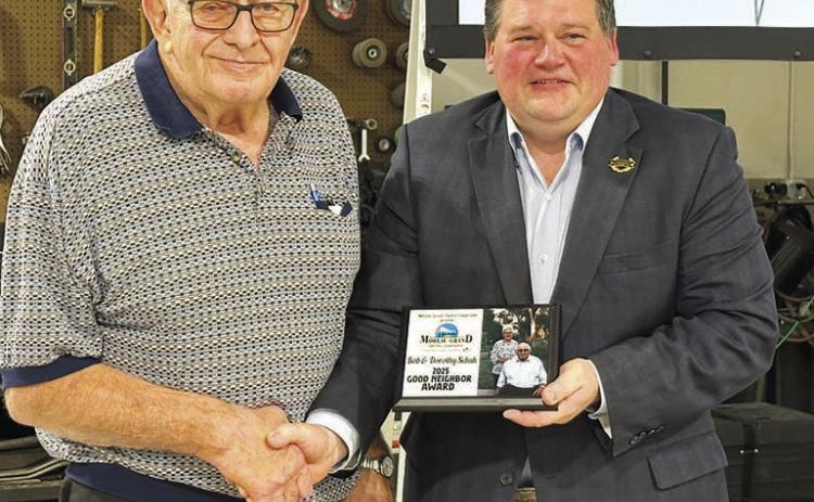 Bob Schuh (left) and his wife Dorothy of Isabel were recipients of the 2025 Good Neighbor award, presented by Ryan Maher, chairman of the Moreau-Grand board. Dorothy was unable to attend as she was recovering from surgery.