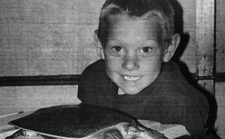 Strange Catch You never know what your fishing line might bring in. Just ask Nathan Hollenbeck. He pulled this rare soft-shelled turtle out of the Grand River during a fishing excursion last week. The creature appears to have a small head but if it gets aggressive, it stretches out a very long neck. Timber Lake Topic, June 5, 2003